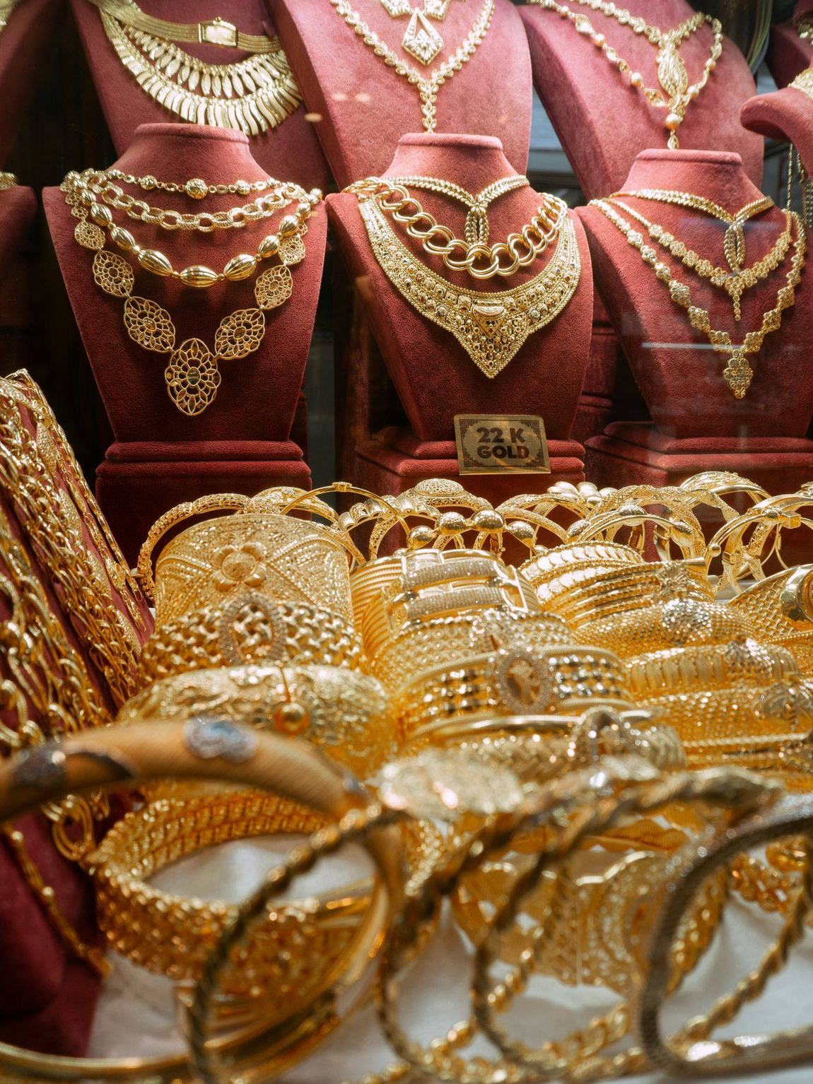Gold necklace sets and bangles on display, Dubai gold souk